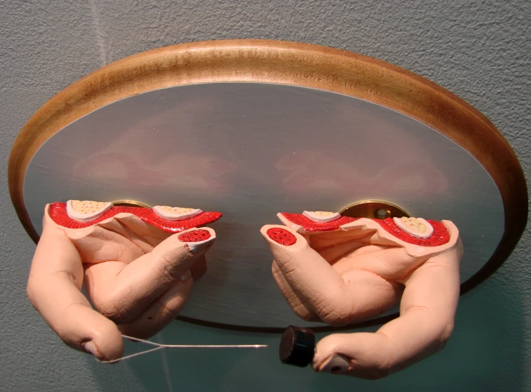 a close up of two hands holding soing with the middle one being soldered