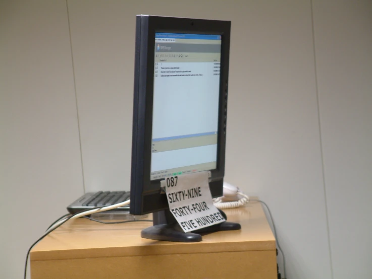 a computer monitor sitting on top of a desk