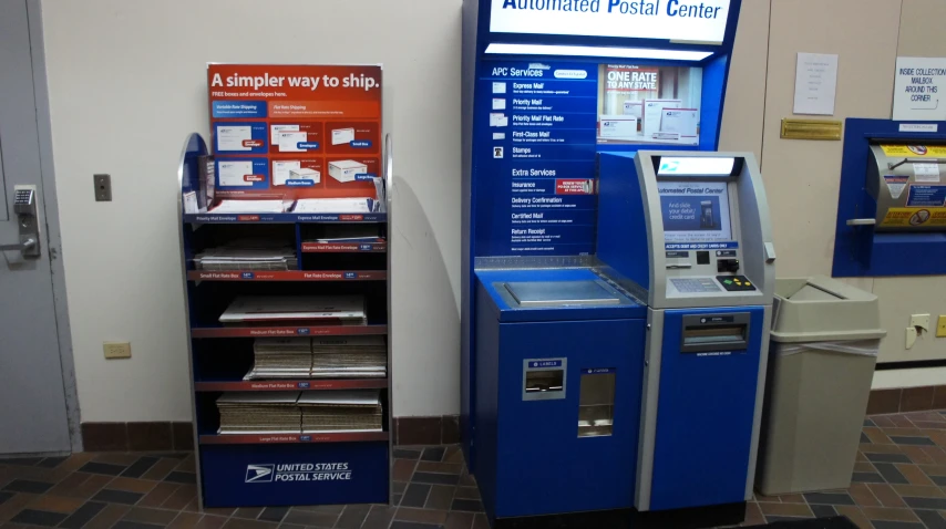 two atm machines side by side near a wall