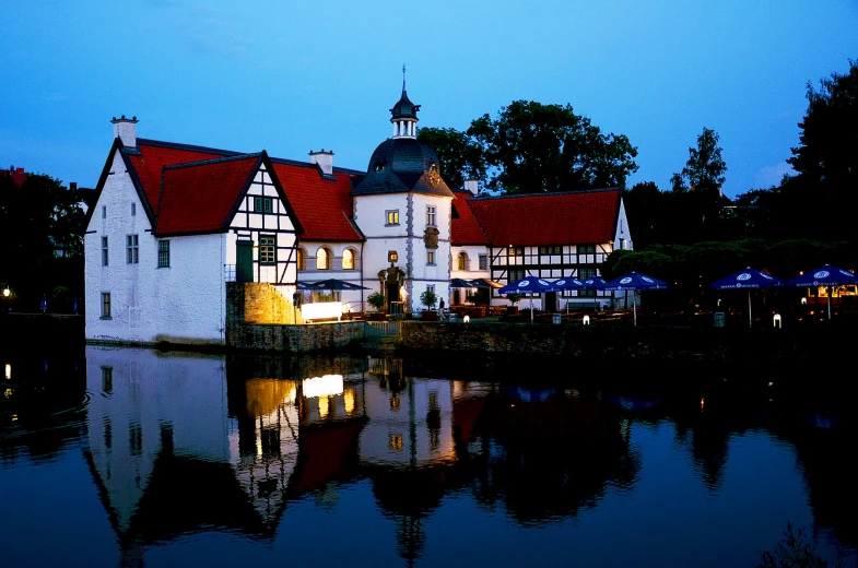 the water house is lit up with lights