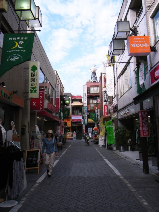 a city street with signs on the buildings