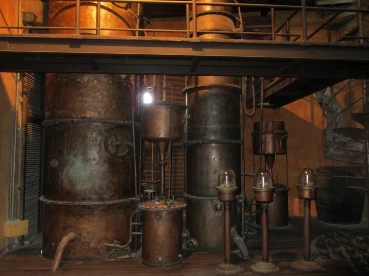many old pipes and tanks are under a stairwell