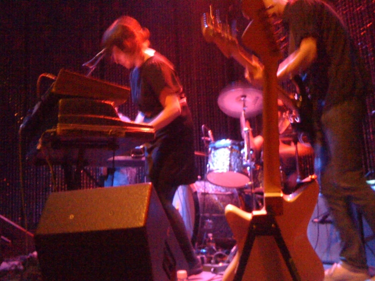 some young men playing a musical instrument at night