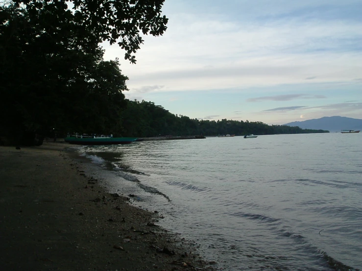 a view of an empty beach in the evening