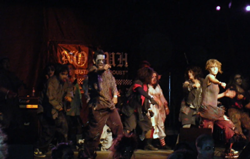 the cast and crew of pirates at night on stage