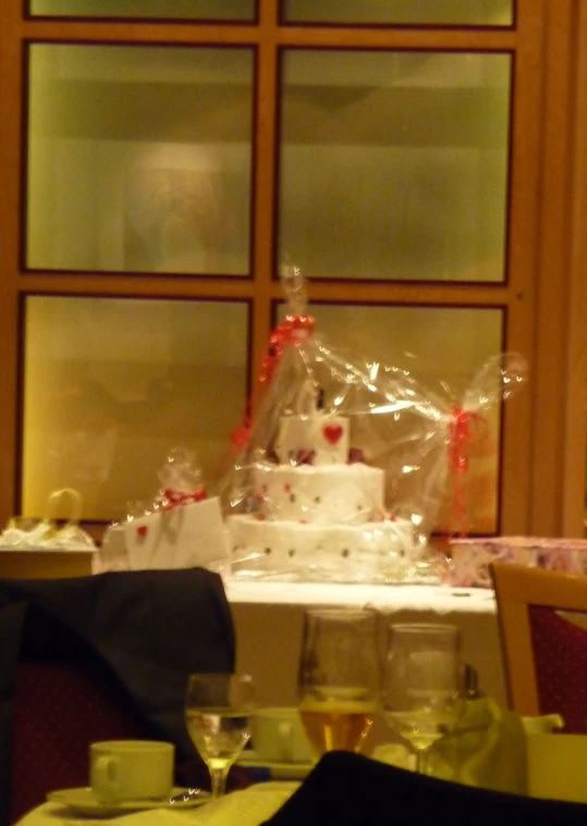 a table in a room decorated for wedding