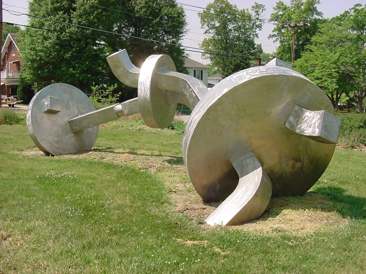 large sculpture sitting in the middle of a yard