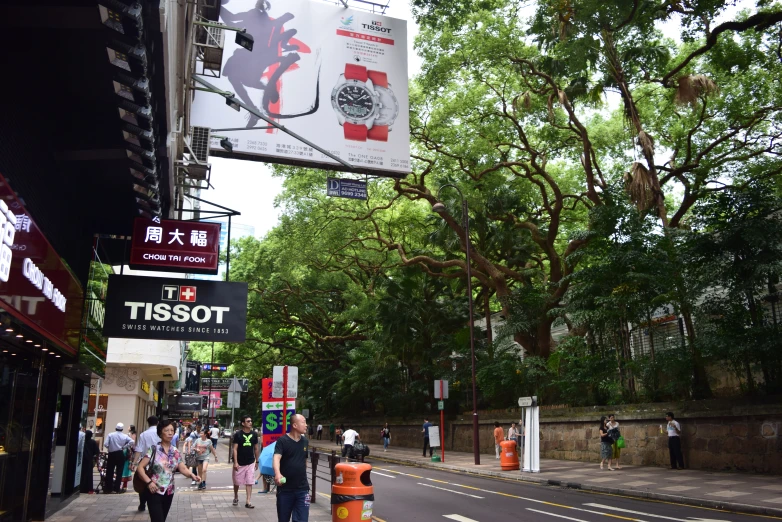 an empty street with people walking down it