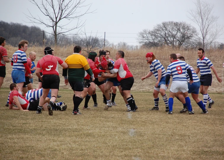 a group of men playing a game of soccer