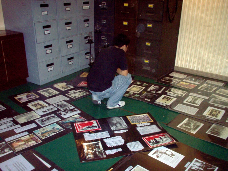 a man kneeling down on the floor in a room