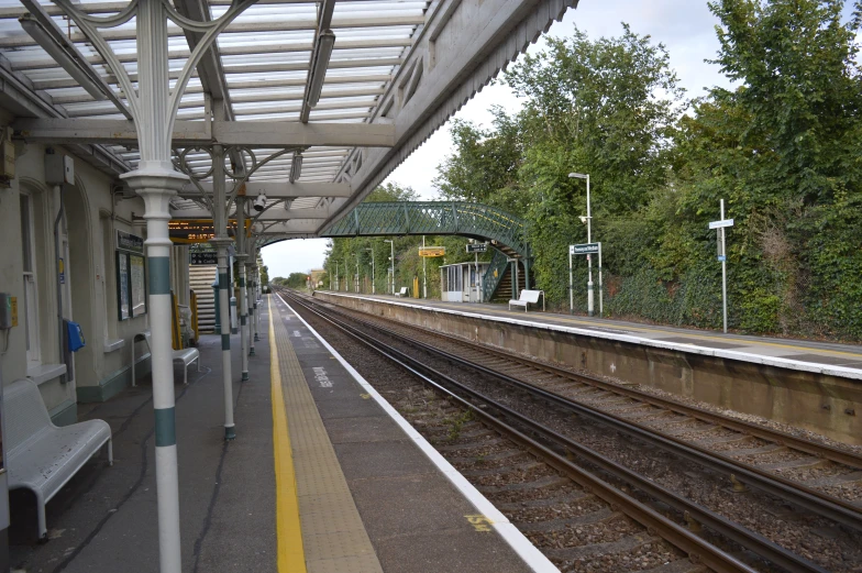 the train tracks run parallel to the rest of the station