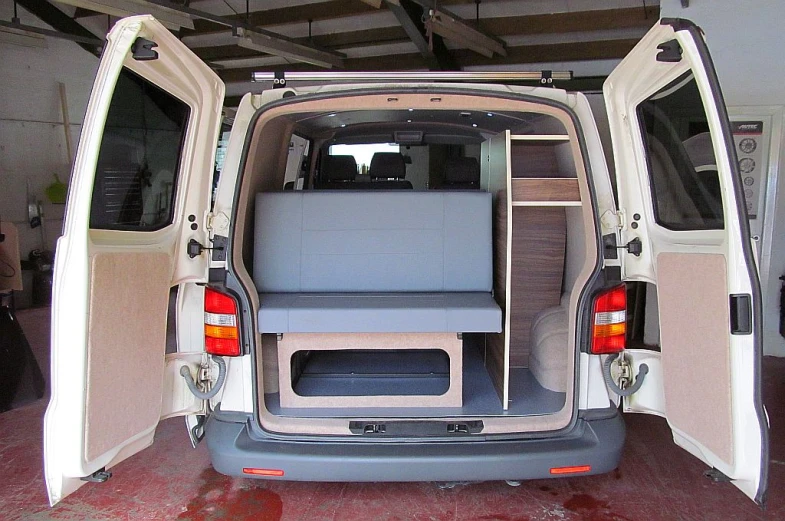 the van has two open seats and shelves