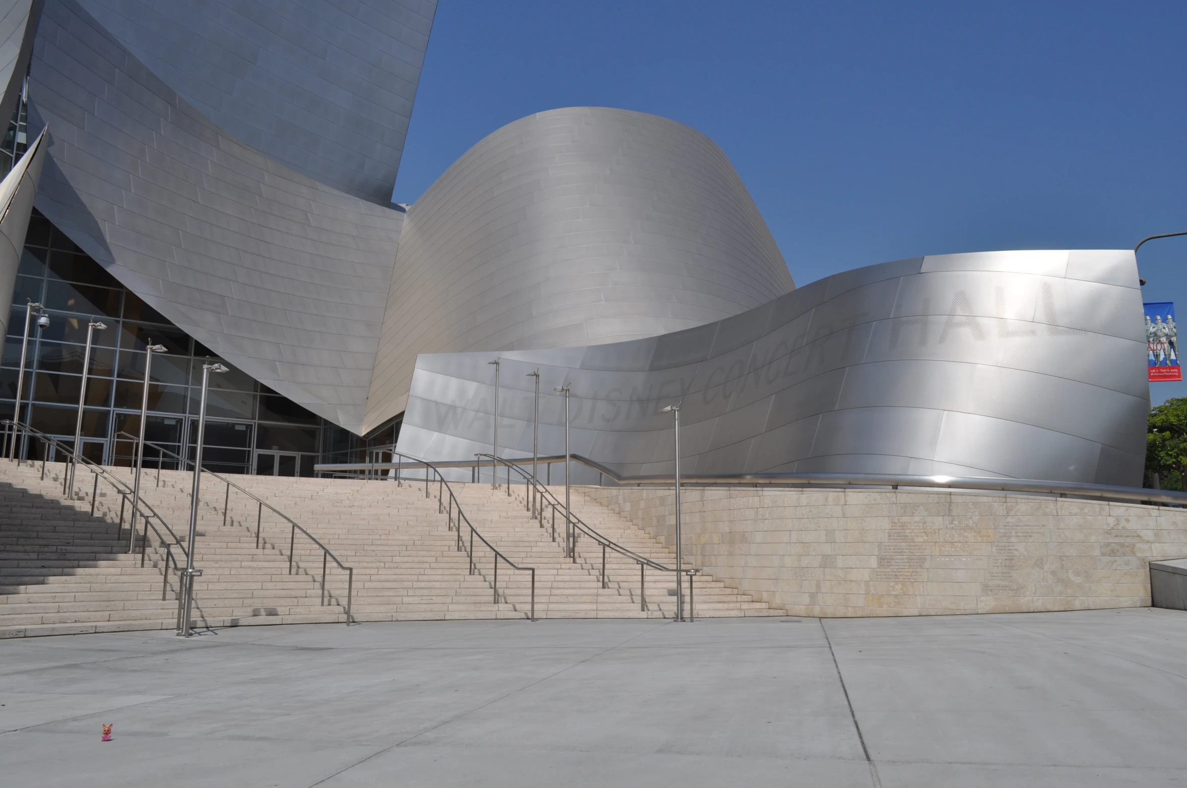 a large modern building with stairs leading up to it