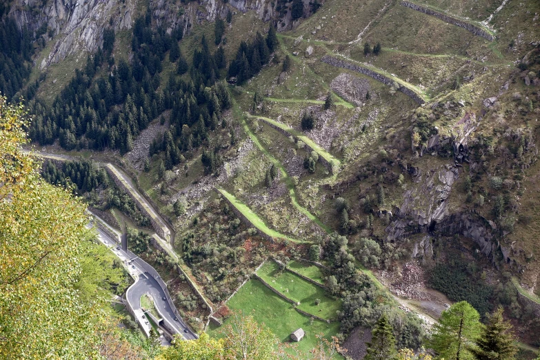 the road curves along the side of a mountain