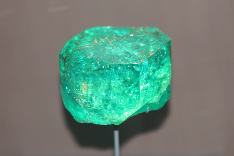 an unusual green rock that is on a table