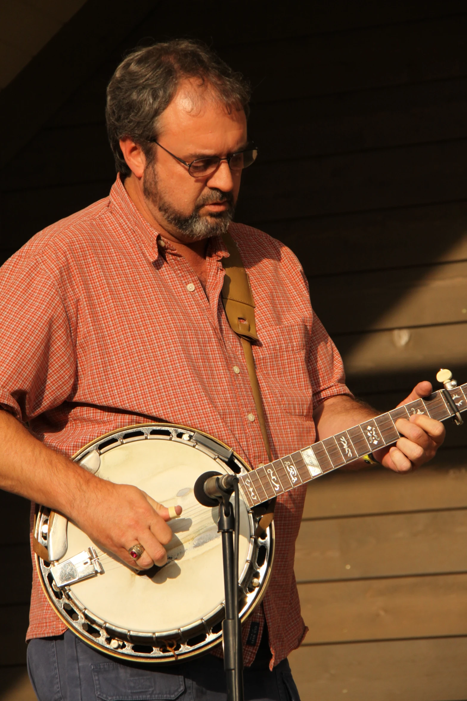 a man holding onto a white guitar