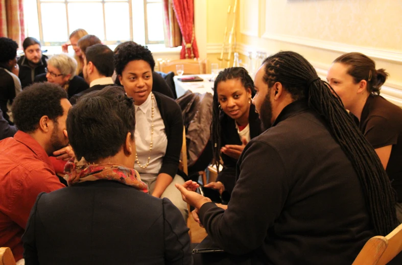 a group of people sitting together at tables