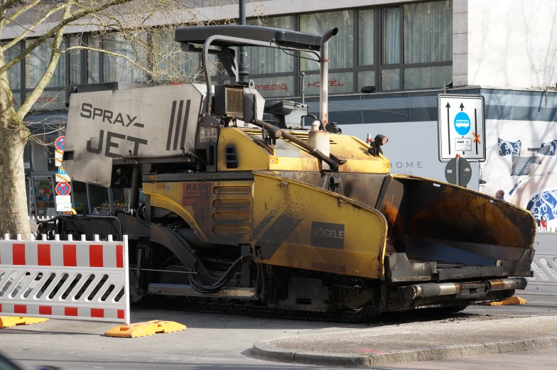 a large bulldozer is being worked on by people