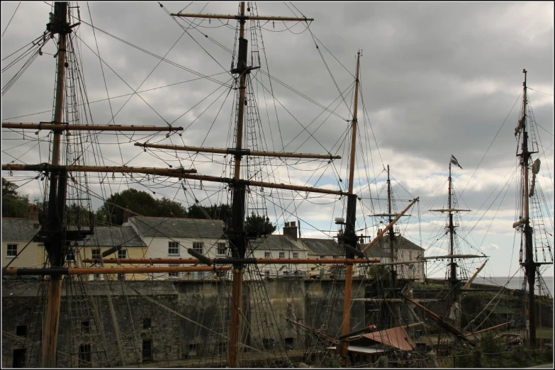 this is an image of an old ship near a house