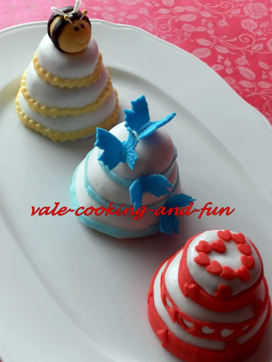 three pastry sitting on top of a white plate