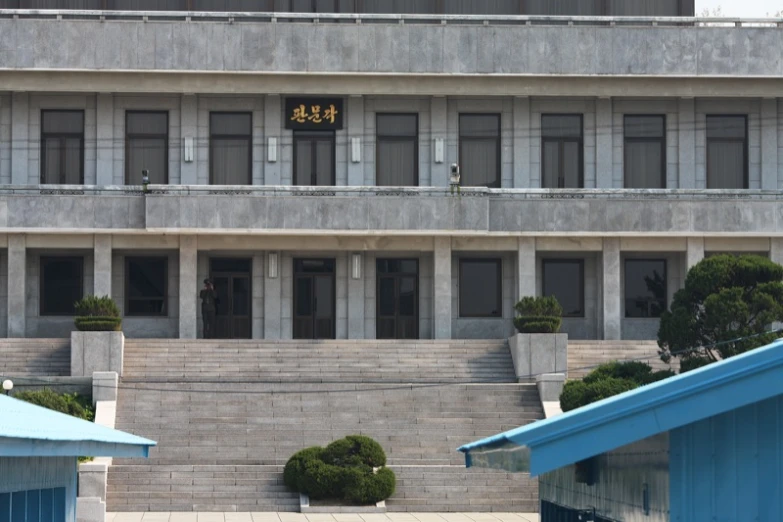 a building with a clock on top of the building