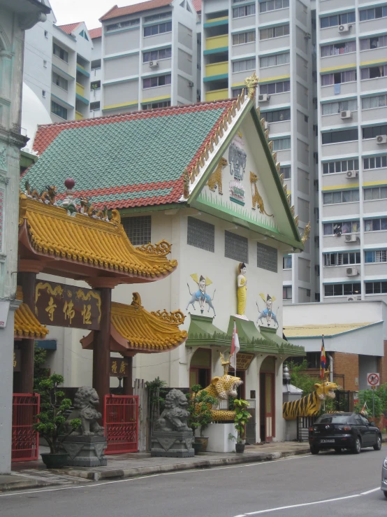 a view of some asian buildings along the side of the road