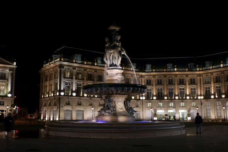 a building with some lights around the clock tower