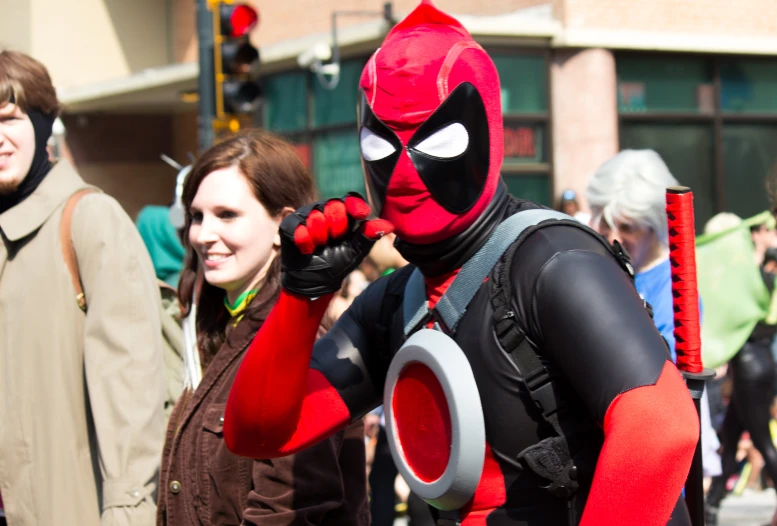 a close up of people in costumes at a street event