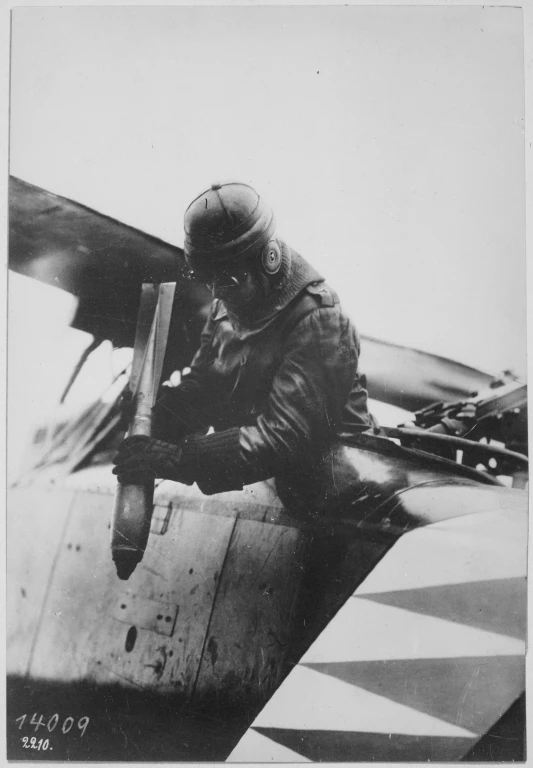 a man standing in the air next to an airplane