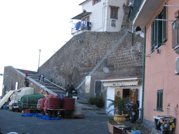 an old building has an staircase leading to a balcony