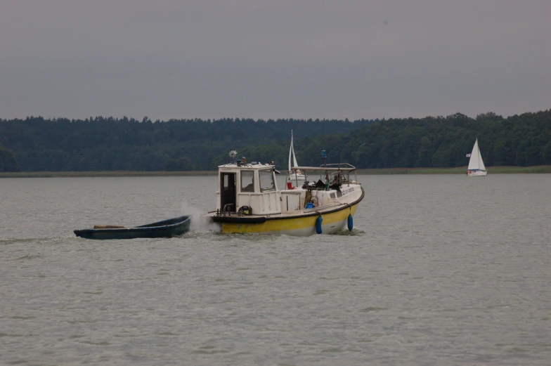 two boats ride close to each other in the water