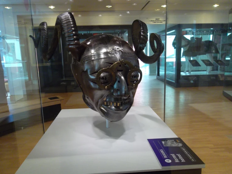 the mask is in a glass case on display