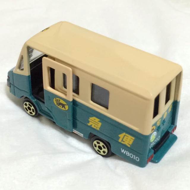 a toy bus with wheels and a small door