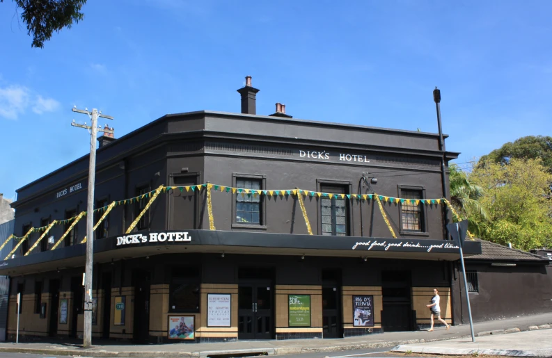 a building in an old fashioned town is decorated with string