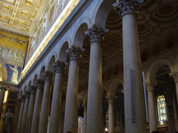 a couple of pillars sit inside of a large room