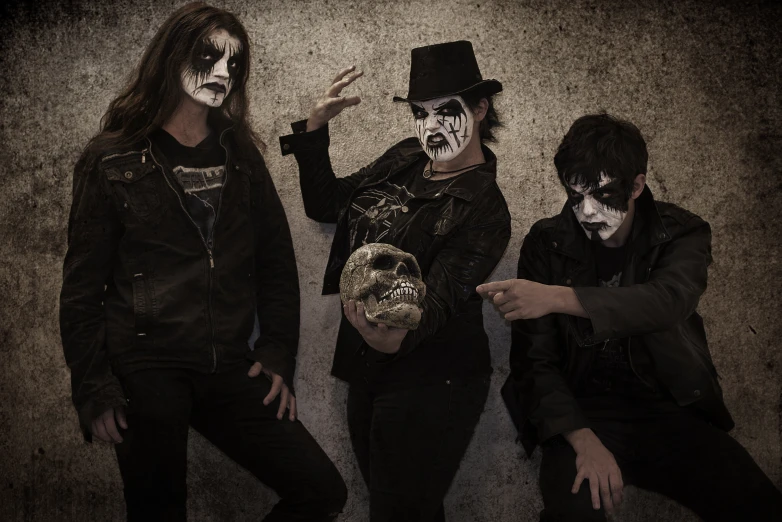 the band kiss poses for a portrait