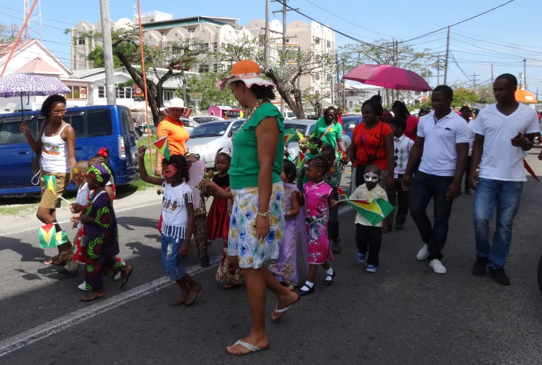 a large group of people walking down the street