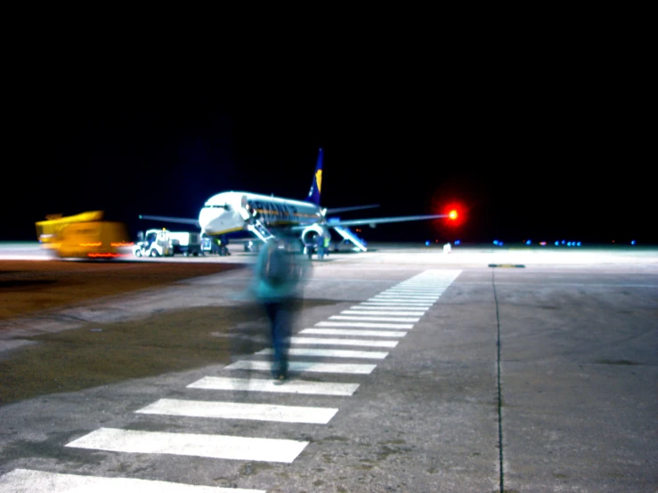 an airplane in the background at an airport