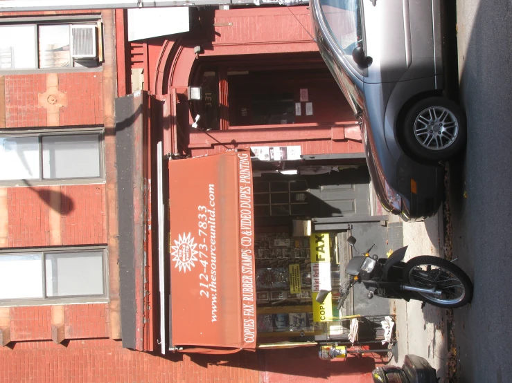 a motorcycle is parked in front of an old building