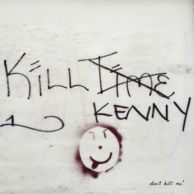 graffiti on a wooden wall reading  those kenny