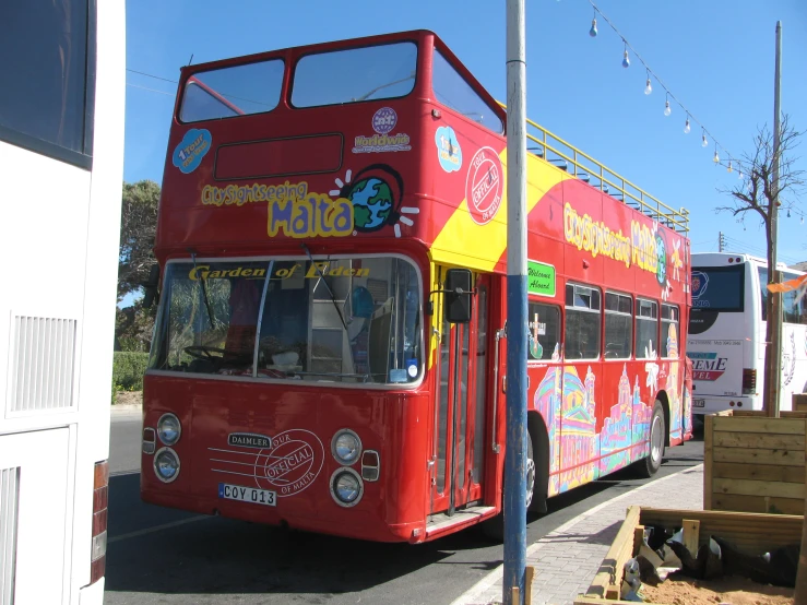 a double decker bus that is on the side of the road