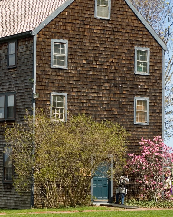 an old house is shown on a sunny day