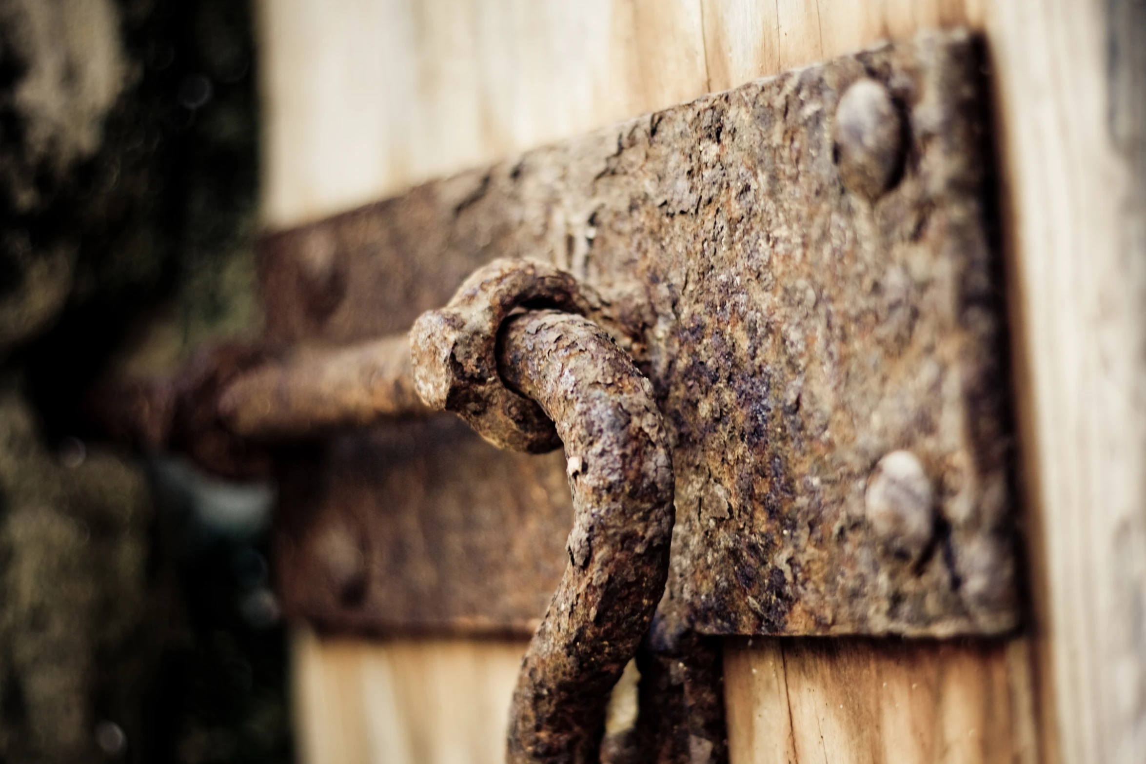 an old and dirty door handle with rivets