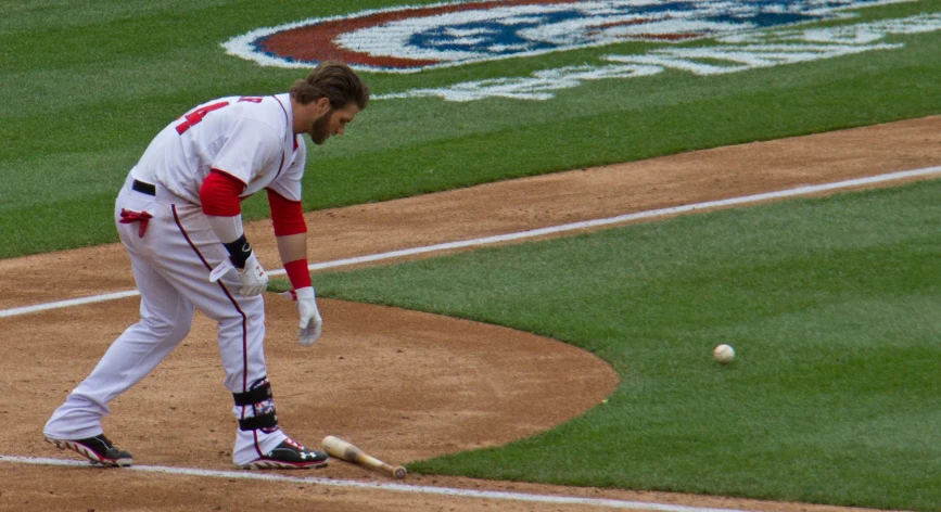 a baseball player with a bat in his hand at the plate