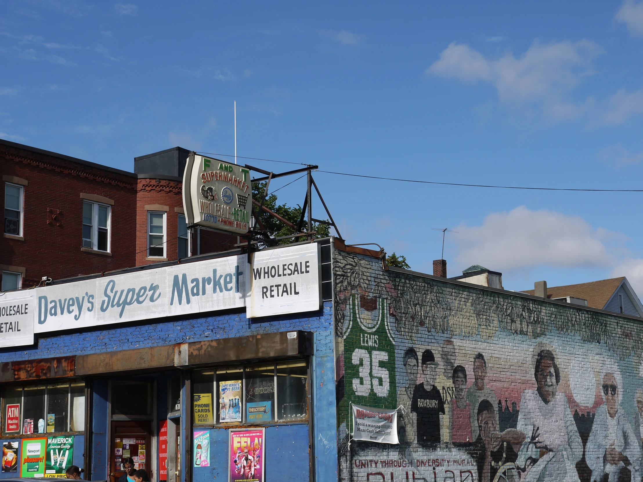 an old commercial store with graffiti on the facade and front