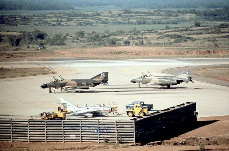 a couple of planes parked in a field