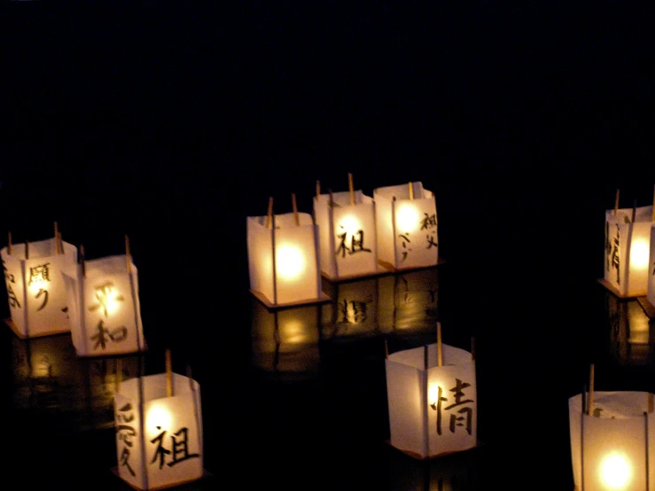 paper lanterns lit up in different asian style