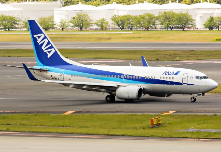 the large airplane has blue and white trim