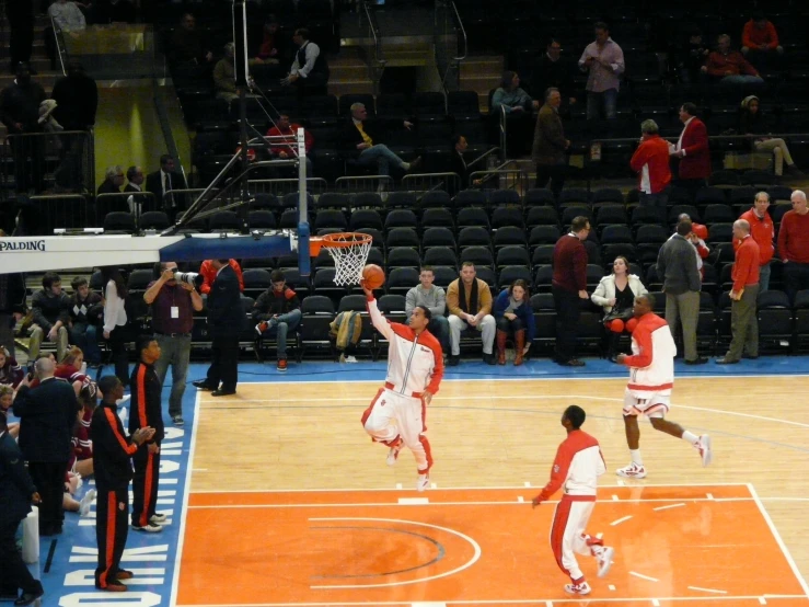 two players are trying to get a s during a basketball game