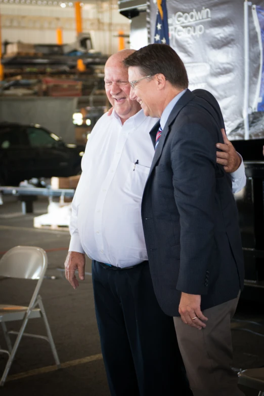 a man emcing another man in a garage